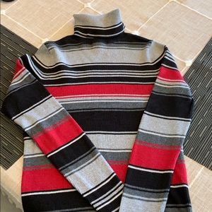 Woman’s striped turtleneck sweater